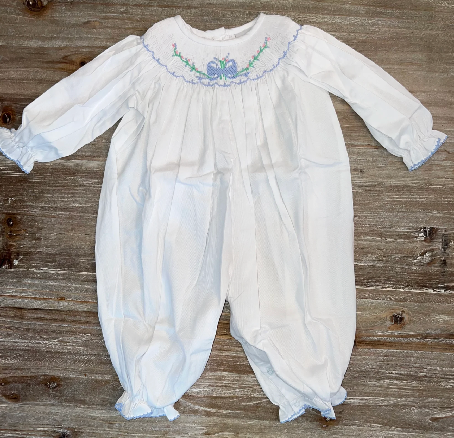 Delaney: Smocked Blue Bow Bishop Bubble